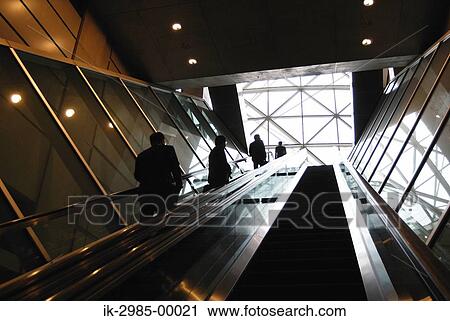 Businessman Ascending Escalator at Tokyo, Japan View Large Photo Image Stock Image - Businessman Ascending Escalator at Tokyo, Japan. Fotosearch