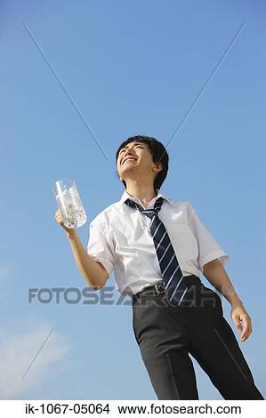 Businessman Holding a Beer View Large Photo Image Picture - Businessman Holding a Beer. Fotosearch