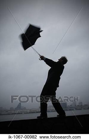 Businessman Holding broken Umbrella View Large Photo Image Stock Image - Businessman Holding broken Umbrella. Fotosearch