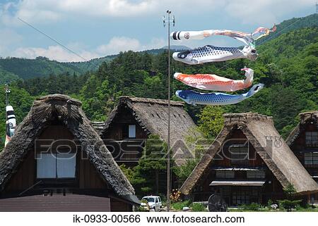 Stock Photograph - Carp Streamer in Front of Japanese Styled House in Japan. Fotosearch