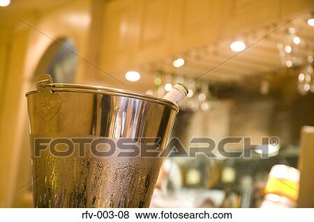 Stock Photo - Champagne Bottle in Bucket. Fotosearch