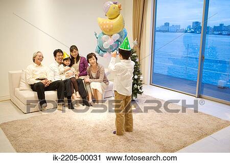Child taking snap of his family View Large Photo Image Stock Image - Child taking snap of his family. Fotosearch
