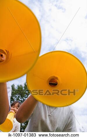 Children cheering through megaphone View Large Photo Image Stock Image - Children cheering through megaphone. Fotosearch
