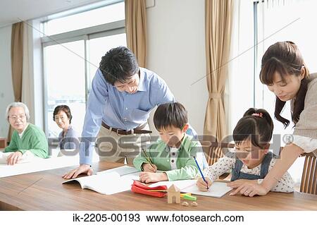 Children doing homework with their parents View Large Photo Image Stock Image - Children doing homework with their parents. Fotosearch
