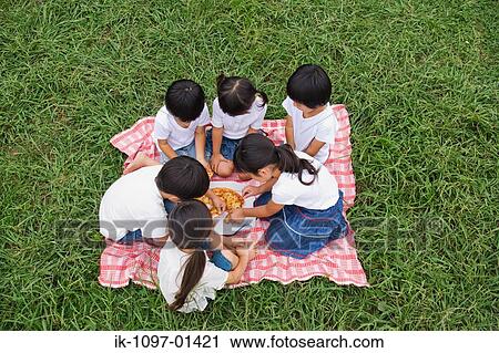 Children enjoying eating pizza View Large Photo Image Stock Image - Children enjoying eating pizza. Fotosearch
