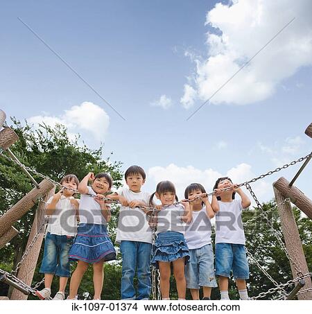 Picture - Children enjoying playing on jungle gym. Fotosearch