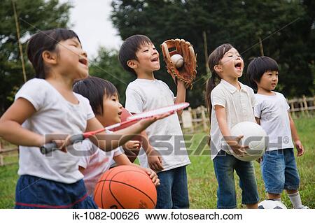 Children holding sports equipments View Large Photo Image Stock Photograph - Children holding sports equipments. Fotosearch