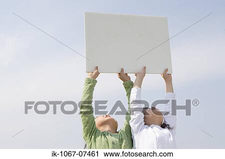 Children holding white cardboard View Large Photo Image Stock Image - Children holding white cardboard. Fotosearch
