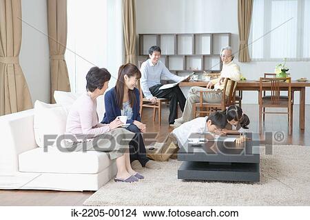 Children painting with family in living room View Large Photo Image Picture - Children painting with family in living room. Fotosearch