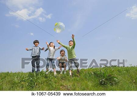 Stock Photo - Children playing in park together. Fotosearch