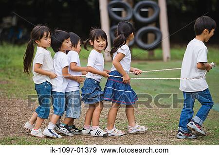 Children playing with rope in a park View Large Photo Image Stock Photo - Children playing with rope in a park. Fotosearch