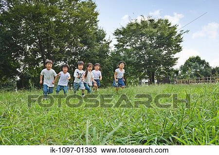 Children running in a park View Large Photo Image Stock Image - Children running in a park. Fotosearch