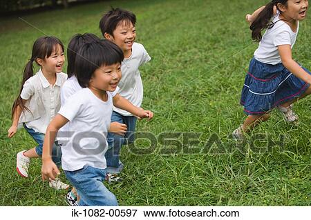 Children running in park together View Large Photo Image Stock Photo - Children running in park together. Fotosearch