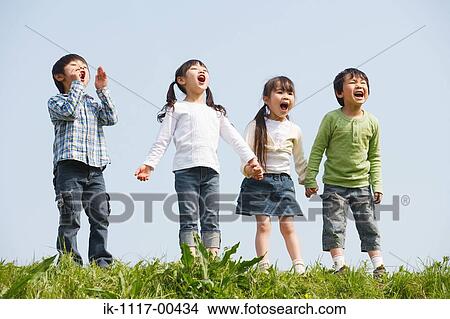 Picture - Children standing in a row and yelling together. Fotosearch