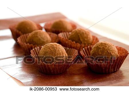 Stock Image - Chocolate Truffle on Table Sheet. Fotosearch