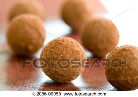Stock Photo - Chocolate Truffle with Cocoa Powder. Fotosearch