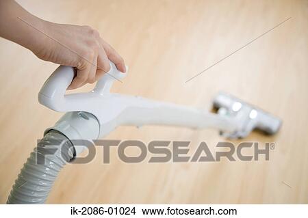 Cleaning Floor with a Vacuum Cleaner View Large Photo Image Picture - Cleaning Floor with a Vacuum Cleaner. Fotosearch