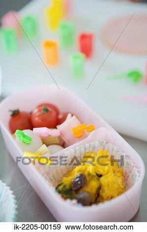 Stock Photo - Delicious food in lunch box. Fotosearch
