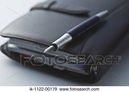 Diary with pen and cellphone View Large Photo Image Stock Photo - Diary with pen and cellphone. Fotosearch