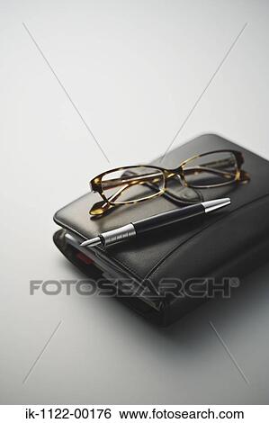Stock Photograph - Diary with pen and cellphone. Fotosearch