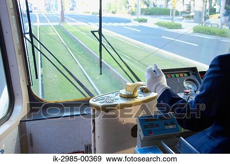 Stock Photo - Driver in Streetcar at Kyushu, Kagoshima Prefecture, Japan. Fotosearch