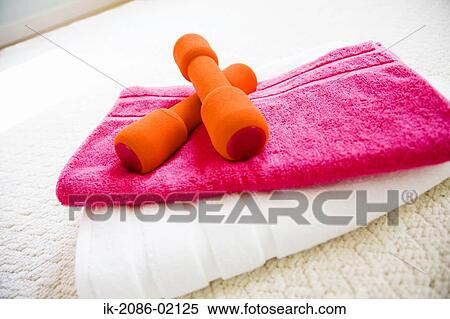 Dumbbells on towels View Large Photo Image Stock Photography - Dumbbells on towels. Fotosearch