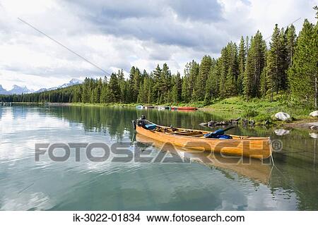 Empty Boat Near the Merlene Lake in Canada View Large Photo Image Picture - Empty Boat Near the Merlene Lake in Canada. Fotosearch
