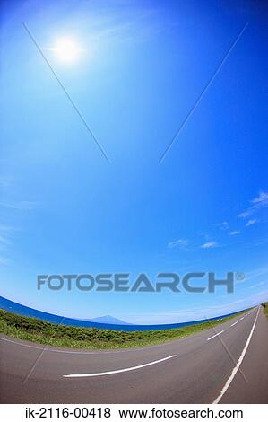 Stock Photo - Empty road against blue sky . Fotosearch