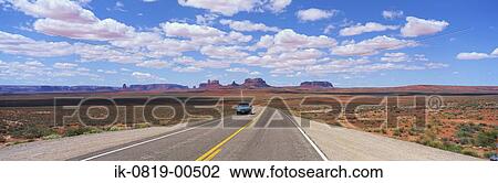 Stock Image - Empty Road against Cloudy Sky. Fotosearch