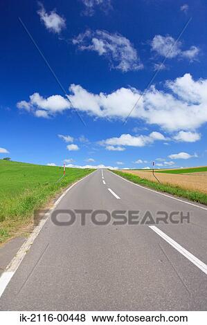Empty road against cloudy sky View Large Photo Image Stock Photo - Empty road against cloudy sky. Fotosearch