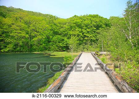 Stock Photo - Empty Sidewalk Near the Tsutanuma Pond Lake in Japan. Fotosearch