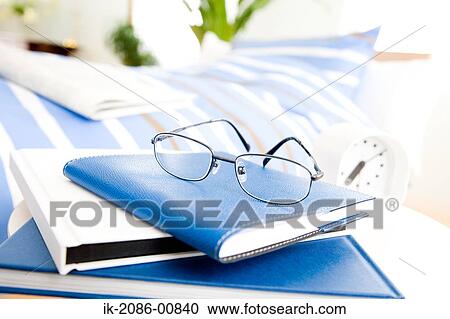 Stock Image - Eyeglasses on Diary. Fotosearch