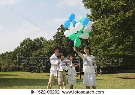 Family Having Fun With Balloons View Large Photo Image Stock Image - Family Having Fun With Balloons. Fotosearch