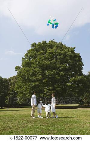 Family Having Fun With Balloons View Large Photo Image Stock Photo - Family Having Fun With Balloons. Fotosearch