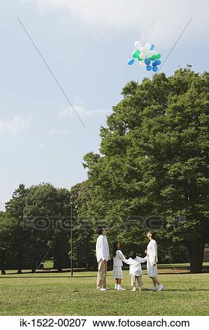 Family Having Fun With Balloons View Large Photo Image Stock Photo - Family Having Fun With Balloons. Fotosearch