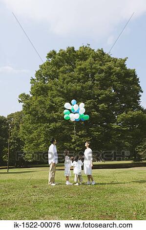 Family Having Fun With Balloons View Large Photo Image Stock Photograph - Family Having Fun With Balloons. Fotosearch
