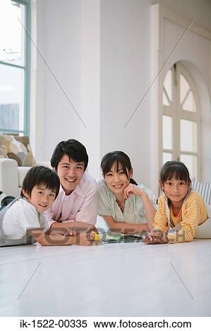 Family Laying Down on Floor View Large Photo Image Stock Photography - Family Laying Down on Floor. Fotosearch