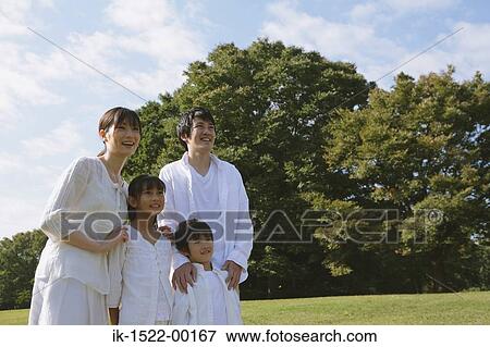 Stock Photo - Family Looking at Something in the Distance. Fotosearch