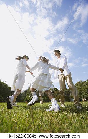 Family Ringing Around the Rosie View Large Photo Image Stock Photography - Family Ringing Around the Rosie. Fotosearch