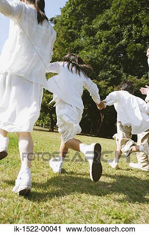 Stock Image - Family Running Together. Fotosearch