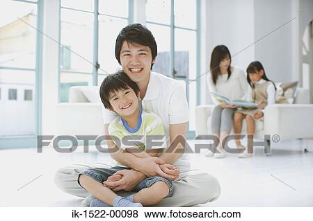 Father and Son Sitting Down View Large Photo Image Stock Photo - Father and Son Sitting Down. Fotosearch