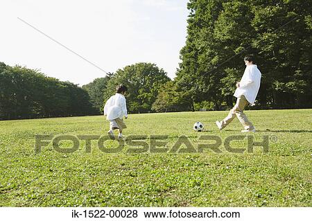 Father Playing Soccer with Son View Large Photo Image Stock Photo - Father Playing Soccer with Son. Fotosearch