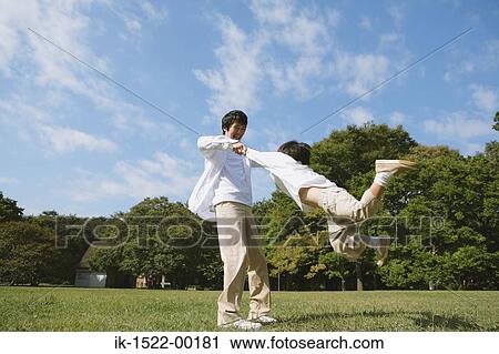 Stock Image - Father Spinning his Son. Fotosearch