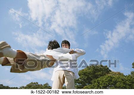 Father Spinning his Son View Large Photo Image Stock Image - Father Spinning his Son. Fotosearch