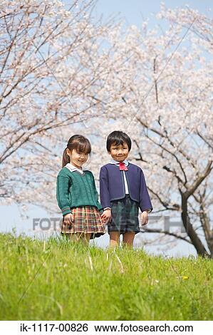 Friends holding hands enjoying in park View Large Photo Image Stock Photograph - Friends holding hands enjoying in park. Fotosearch