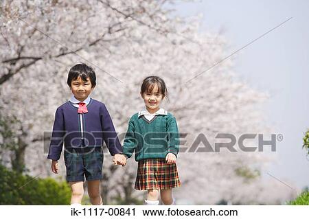 Friends walking while holding hands View Large Photo Image Stock Image - Friends walking while holding hands. Fotosearch