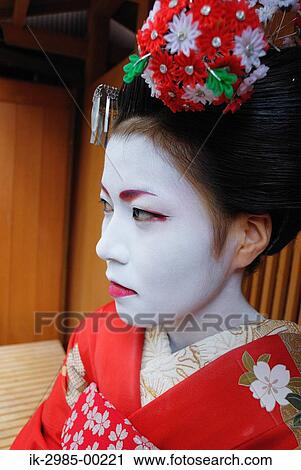 Stock Image - Geisha in Traditional Make-Up and Hairstyle. Fotosearch