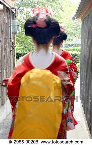 Stock Photo - Geisha Women Walking on Street in Kyoto, Japan. Fotosearch