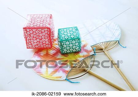 Stock Photo - Gift boxes with traditional bamboo fans. Fotosearch
