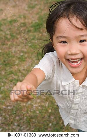 Girl child smiling and laughing View Large Photo Image Stock Photo - Girl child smiling and laughing. Fotosearch